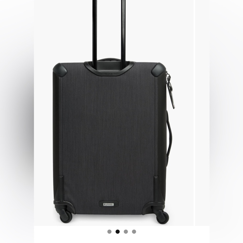 New Never used Tumi expandable 4 wheeled luggage